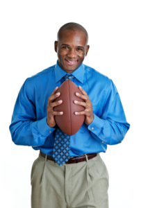 Coach holding football
